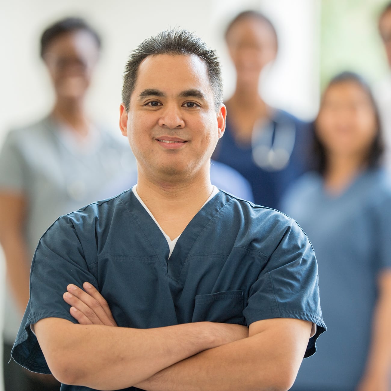 Nurse facing camera smiling